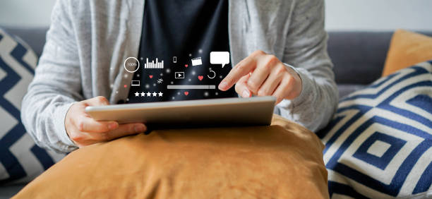 close up on man holding tablet to play entertainment or using website to search on internet of social media marketing  for iot lifestyle and business network technology business concept