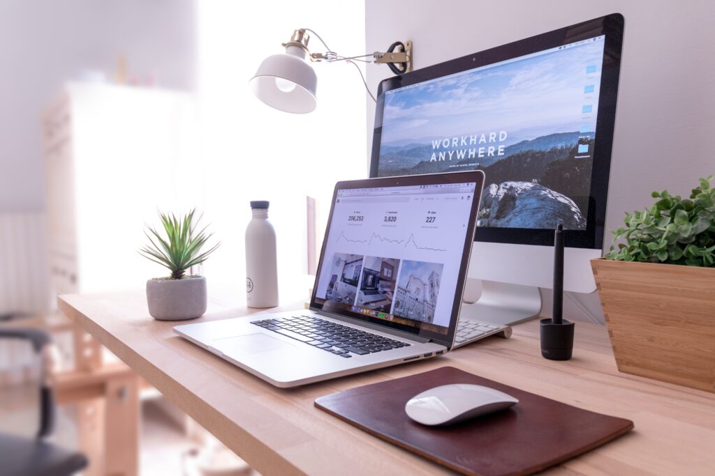 Desktop and Laptop on an office table displaying custom wordpress design