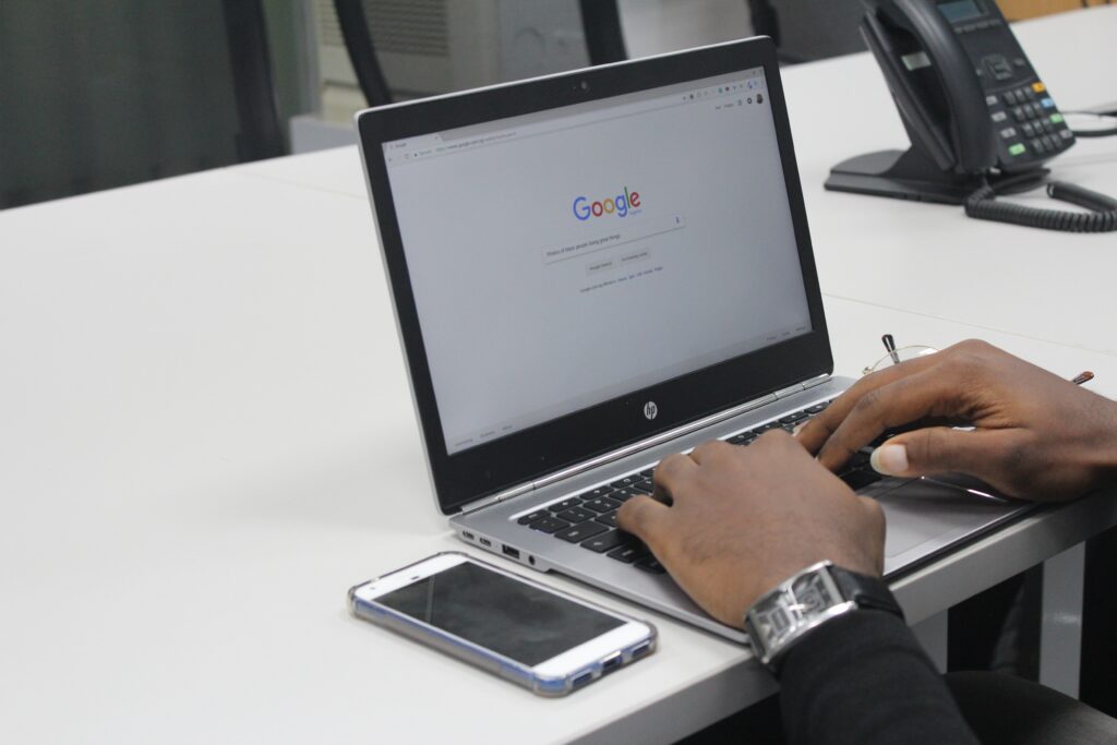 Man Typing on Google